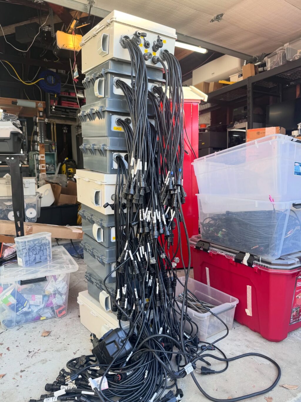 Behind every glowing holiday show is a garage that silently does the most, and has absolutely seen some things. 👀

Everyone always asks how long it takes to setup. 
No one asks about the teardown, the Tetris level stacking, or the moment you realize you might actually be out of space. 

This is only a small fraction of the controllers, wiring, props, and mystery bins that make the show happen. 

Let the organization Olympics begin.