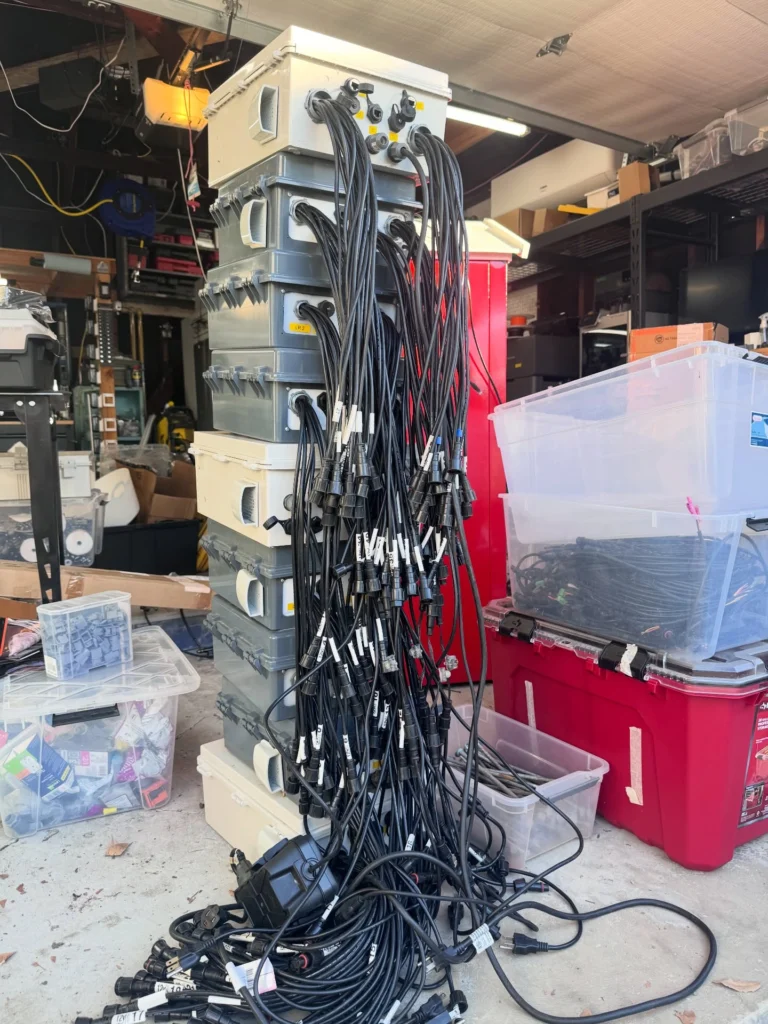 Behind every glowing holiday show is a garage that silently does the most, and has absolutely seen some things. 👀

Everyone always asks how long it takes to setup. 
No one asks about the teardown, the Tetris level stacking, or the moment you realize you might actually be out of space. 

This is only a small fraction of the controllers, wiring, props, and mystery bins that make the show happen. 

Let the organization Olympics begin.